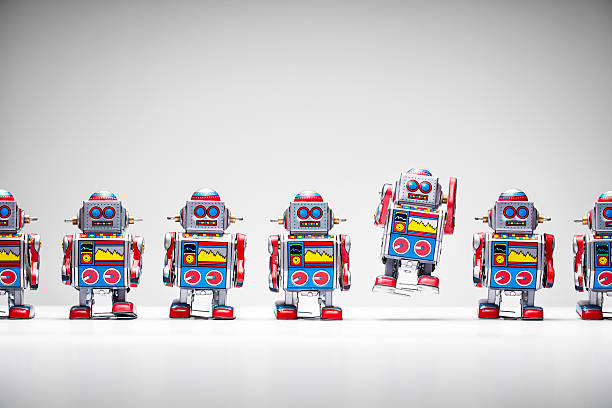 istock Retro tin toy robots standing in a row 514174907