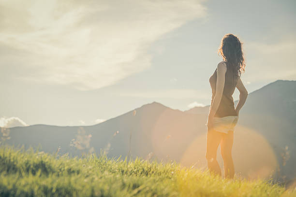 istock Young half-face woman looking at panorama on mountain 514175259