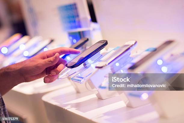 Buying Smartphone Stock Photo - Download Image Now - Store, Mobile Phone, Telephone