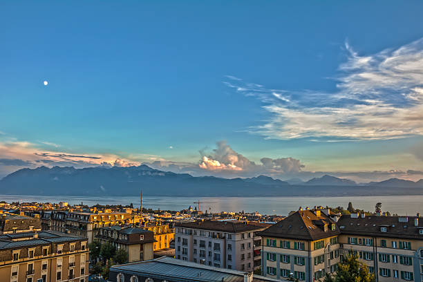 View over Lausanne at sunset, lake Geneva and Alps