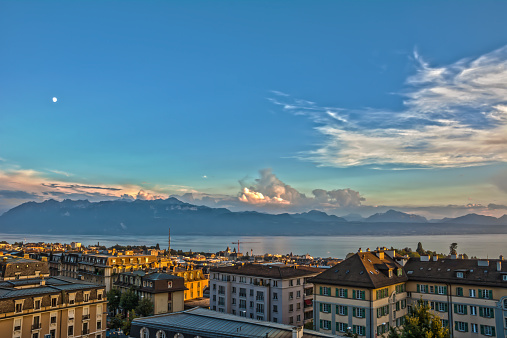 View over Lausanne at sunset, lake Geneva and Alps