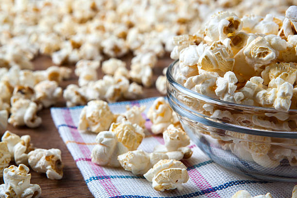 istock lot of salt popcorn into a bowl 514176577