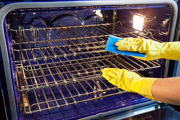 Cleaning the Oven stock photo
