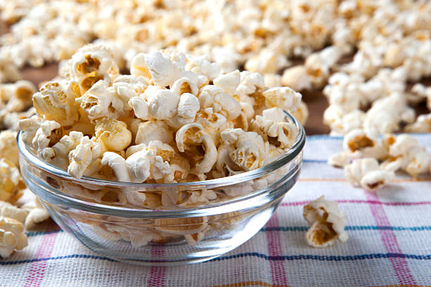 istock lot of salt popcorn into a bowl 514176593