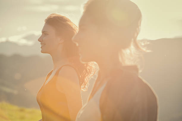 istock Young women looking at panorama on mountain in sunny day 514177279