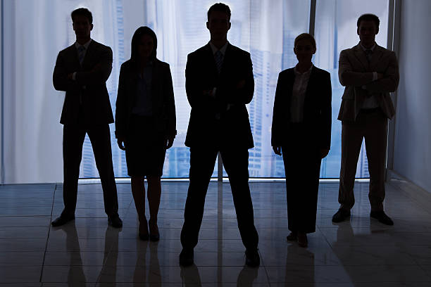 istock Silhouette Business People Standing In Office 514178369