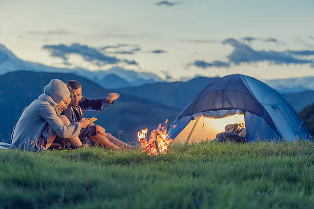 istock Three friends camping on mountain at sunset 514179429