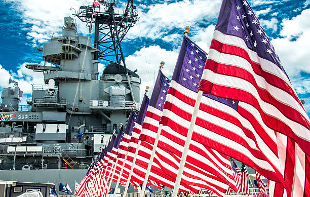 American Flags in Front of the USS Missouri American Flags in Front of the USS Missouri battleship photos stock pictures, royalty-free photos & images