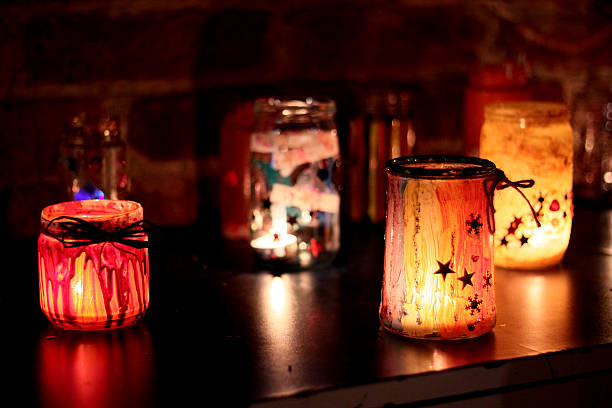 istock Several decorated colorful candles sitting on table at night 514180433