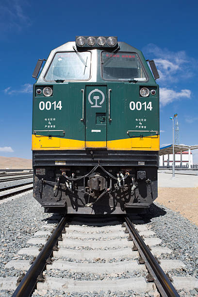 Tibet, China - April 15, 2013: View of the locomotive of the Shanghai - Lhasa train stopped in a train station in Tibet. China 2013.