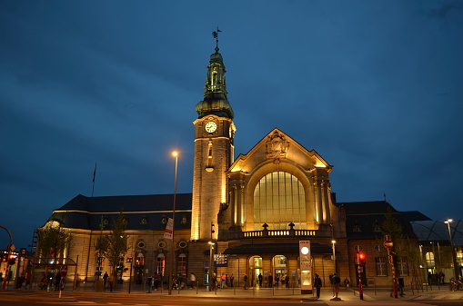 Luxembourg city, Luxembourg, April 7, 2014: Luxembourg railway station during the night with a crowds of people passing by.