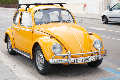 Calafel, Spain - August 20, 2014: Yellow Volkswagen Kafer stands parked on the roadside