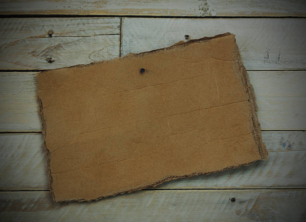 istock Cardboard sign on a wooden background 514214368