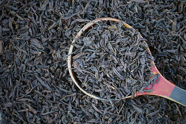 istock tea granules with a wooden spoon 514214384