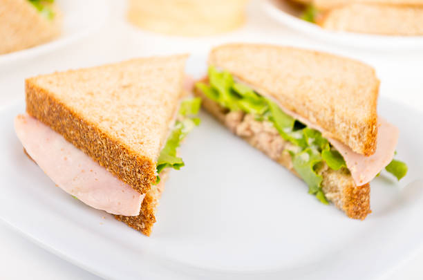 istock ham and lettuce sandwich on a white plate 514215295