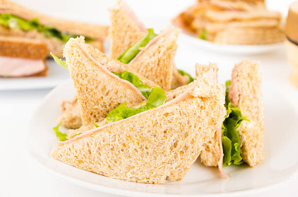 istock ham and lettuce sandwich on a white plate 514215299