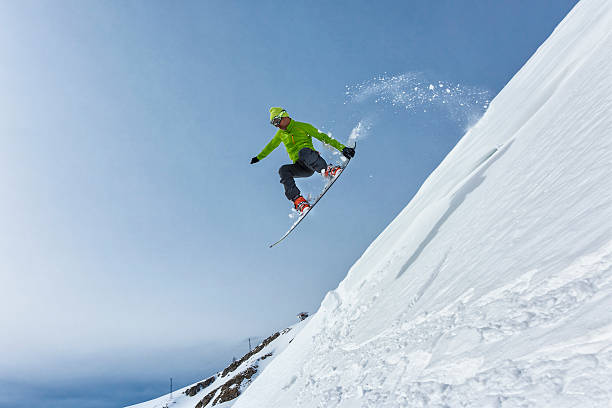 Skier with sun and mountains stock photo