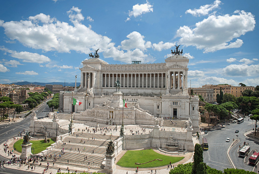 Rome, Italy - September 1, 2014: Tourists visit The Altar of the Fatherland on a cloudy day.