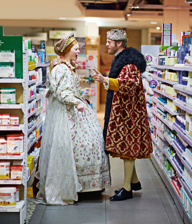 A king and queen arguing in the aisle of a supermarket