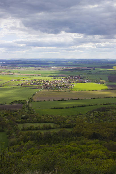 istock Large landscape with cloudy sky and selective sun shine 514216983