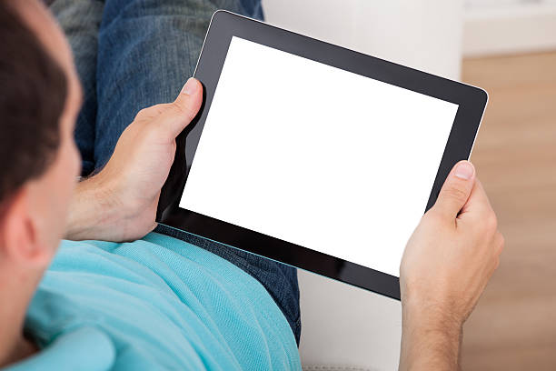 istock Man Looking At Blank Screen Of Digital Tablet 514217247