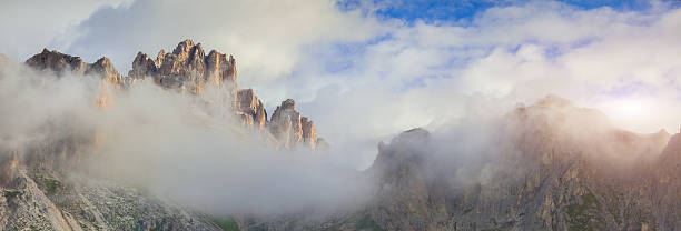 istock Tofane mountain range at foggy morning. 514217663