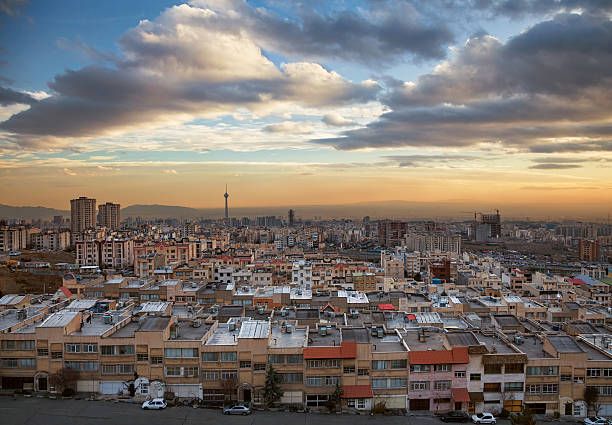 Tehran Skyline During Sunset with Dramatic Clouds stock photo