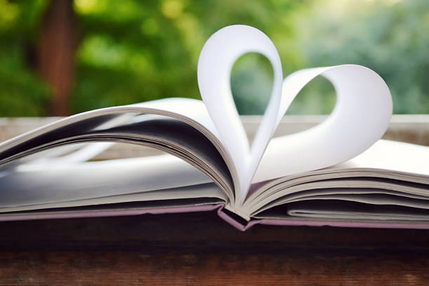 istock Book pages curved into a shape of heart 514218377