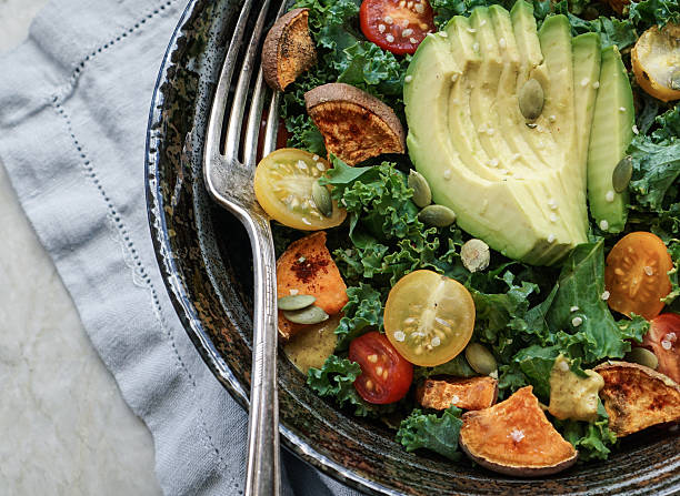 istock Kale, roasted yams and avocado salad 514220572