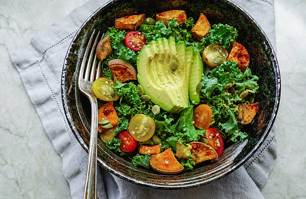 istock Kale, roasted yams and avocado salad 514220954