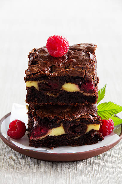 istock Chocolate brownie with raspberries and mascarpone. 514221120