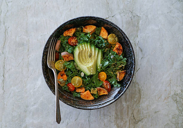 istock Kale, roasted yams and avocado salad 514221270