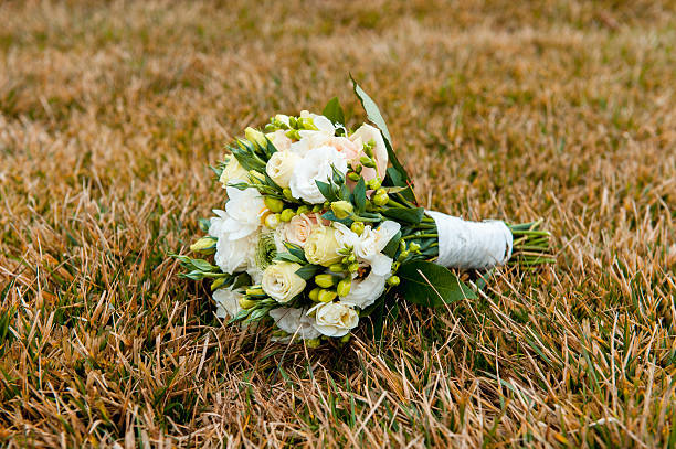 istock Beautiful bridal bouquet on a green grass 514222108