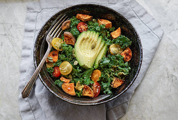 istock Kale, roasted yams and avocado salad 514222116