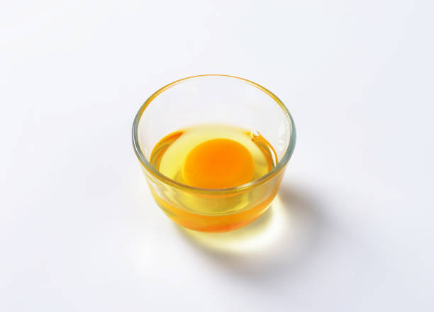 istock Egg white and yolk in glass bowl 514222120