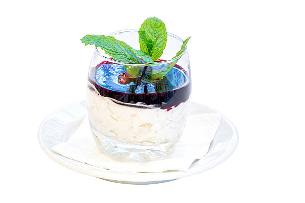 sweet rice desert sweet rice cream desert with raspberry sauce and mint on white background beatifull stock pictures, royalty-free photos & images