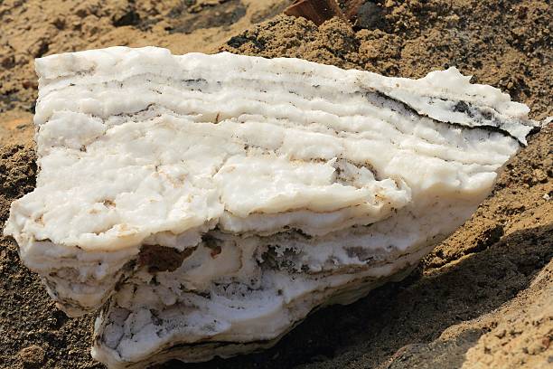 Salt block-artificial pool for water evaporation-salt mounds beside the W.bank on the S.section of the c.100 km2-102 ms.below sea level-160 ms.deep Lake Afrera. Danakil-Adm.zone 2-Afar region-Ethiopia