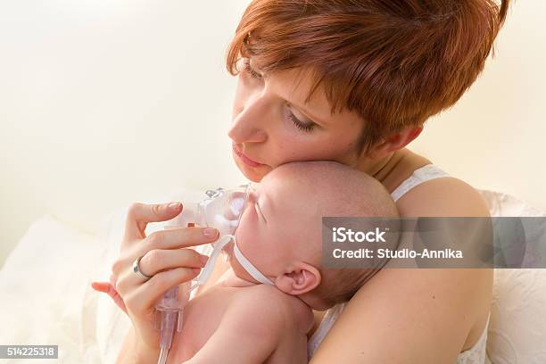 Loving Mom Treating Sick Baby Stock Photo - Download Image Now - Asthmatic, Baby - Human Age, Newborn