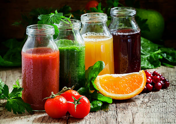 istock Bottles with fresh juices from fruits and vegetables 514227140