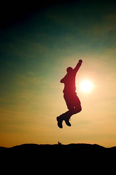 istock Jumping young crazy  man is jumping.Silhouette of hiker 514227924