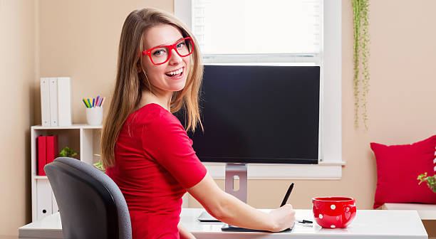istock Happy young woman working in her home office 514229418