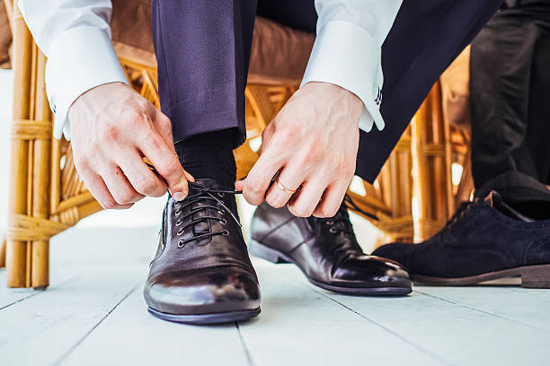 istock Man  fasten shoe-laces 514232778