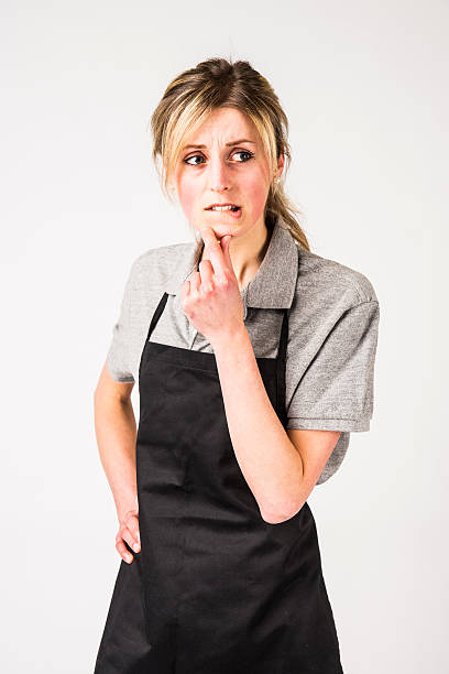 istock Employee is uniform looking worried or concerned. 514233328