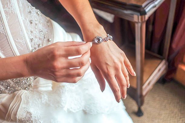 istock Bridal hand with silver bracelette 514234296