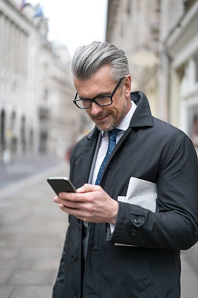 istock Business man texting on his phone 514236330