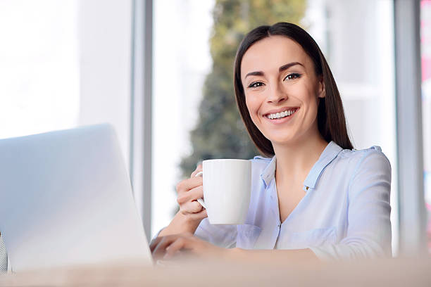 istock Pleasant business woman sitting at the table 514236602