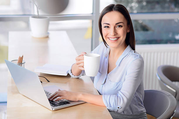istock Pleasant business woman sitting at the table 514236610