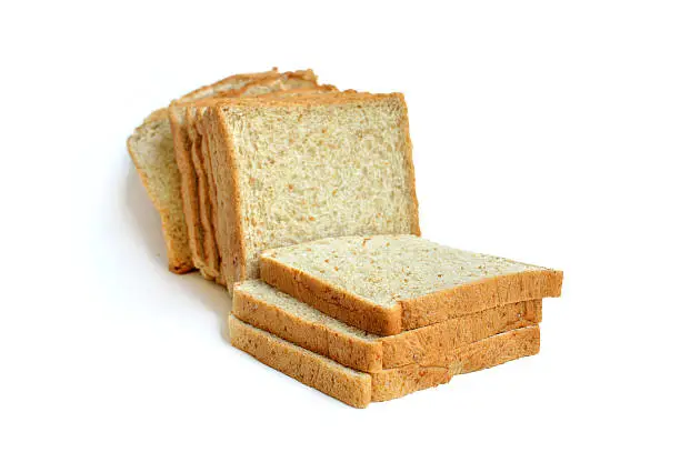 Photo of Slices of whole wheat bread isolated on white background