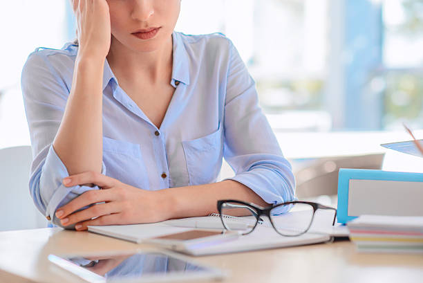 istock Sad woman sitting at the table 514236920