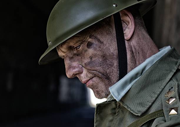 istock battle weary, soldier leaning against a wall in a bunker 514245329
